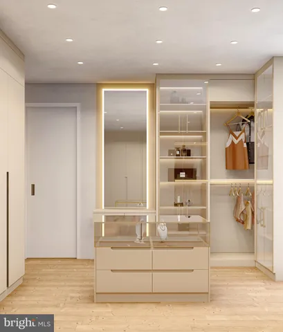 a view of a livingroom with wooden floor and a window