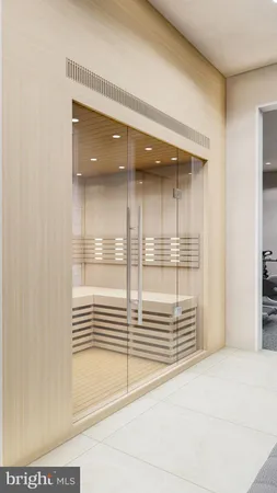 a bathroom with a glass shower door