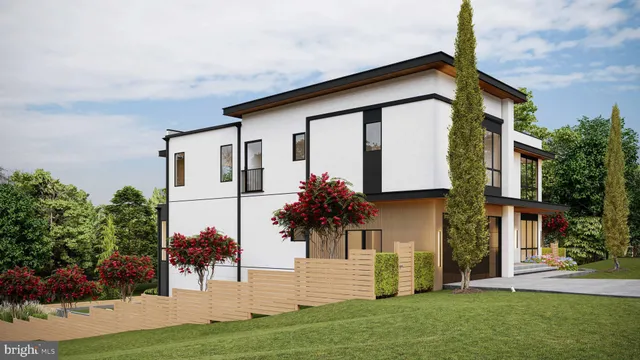 a front view of a house with a garden and yard