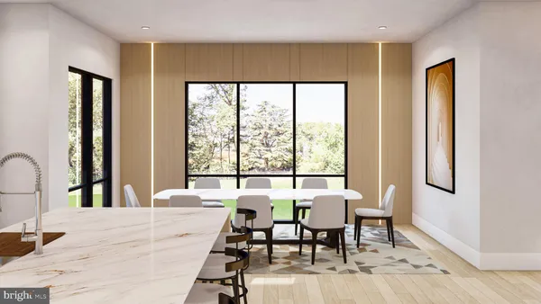 a view of a a dining room with furniture window and wooden floor