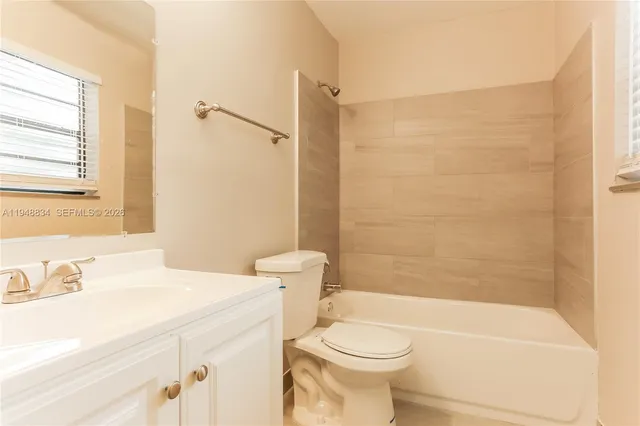 a bathroom with a sink a toilet and a bathtub