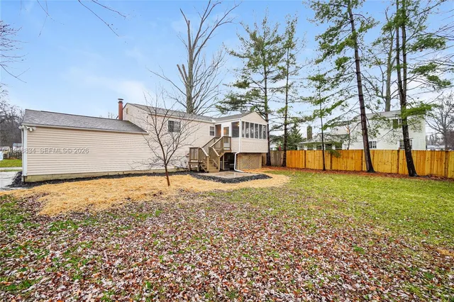 a house with trees in front of it