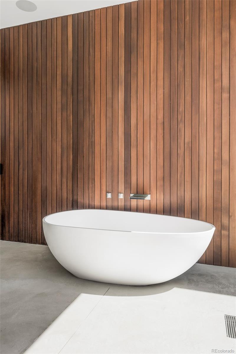 4100 Bryant Street Denver, CO 80211 - Photo 14 of 30 a white bath tub sitting in a bathroom