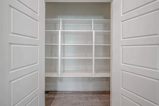 a view of an empty walk in closet