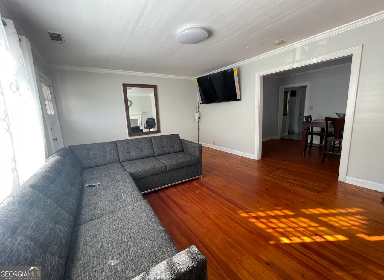 1401 Panola Road Stone Mountain, GA 30088 - Photo 5 of 15 a living room with furniture and a flat screen tv