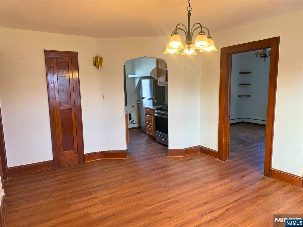 58 Hathaway Street, Unit 2 Wallington, NJ 07057 - Photo 4 of 9 a view of a livingroom with wooden floor
