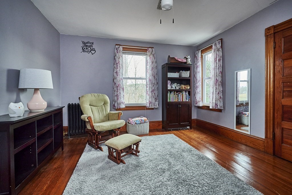 21 Poplar Hill Road Haydenville, MA 01039 - Photo 34 of 42 a living room with furniture a lamp and a window