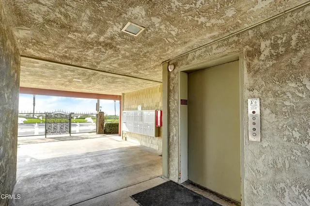 a view of a glass door with a yard
