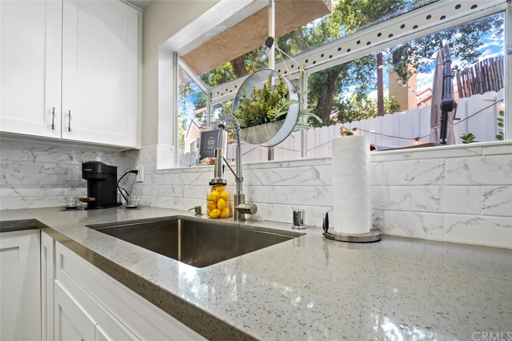 6255 Honolulu Avenue, Unit 23 Tujunga, CA 91042 - Photo 13 of 36 a kitchen with a sink and a stove top oven