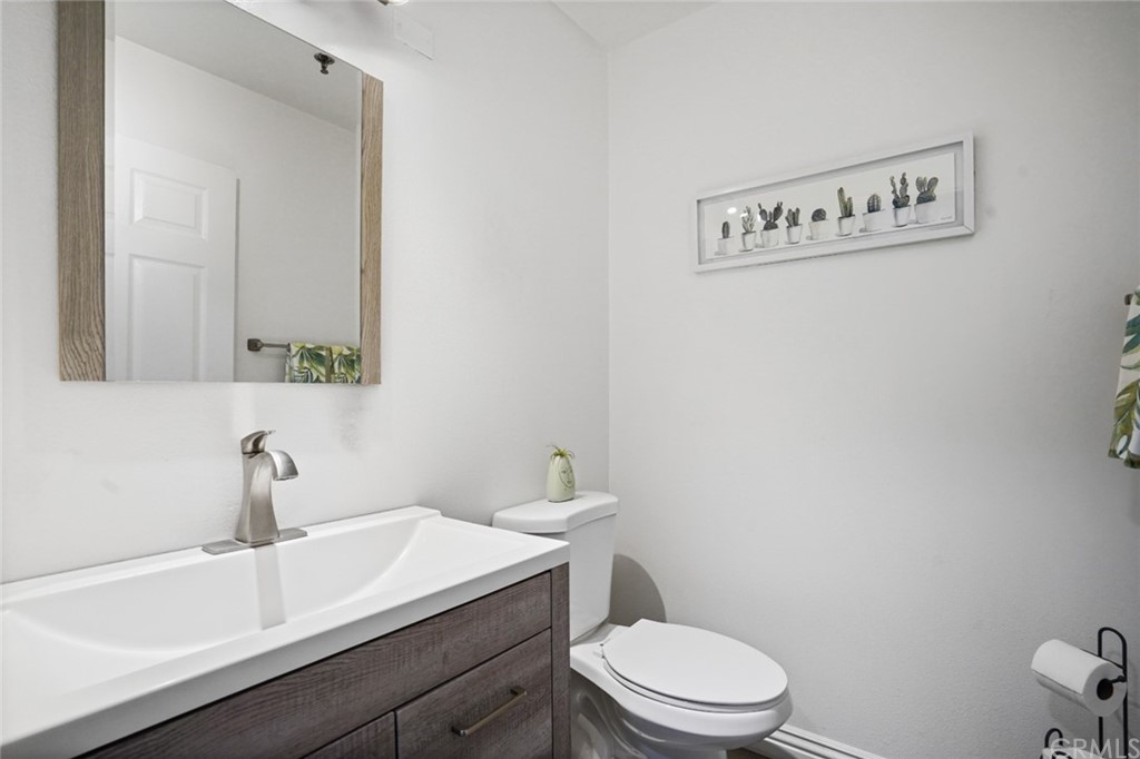 6255 Honolulu Avenue, Unit 23 Tujunga, CA 91042 - Photo 15 of 36 a bathroom with a sink a toilet and mirror