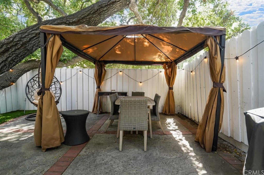 6255 Honolulu Avenue, Unit 23 Tujunga, CA 91042 - Photo 18 of 36 a backyard of a house with table and chairs