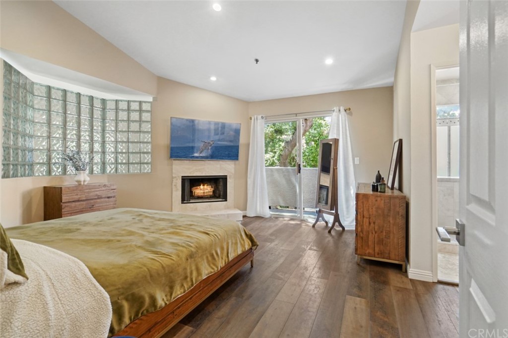 6255 Honolulu Avenue, Unit 23 Tujunga, CA 91042 - Photo 22 of 36 a spacious bedroom with a large bed and a couch