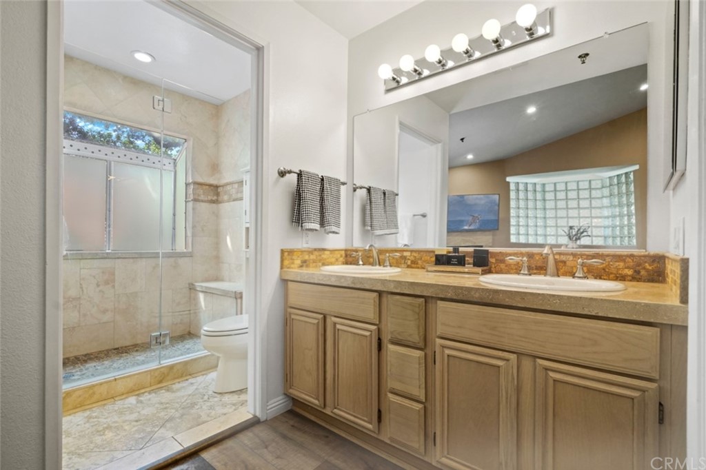 6255 Honolulu Avenue, Unit 23 Tujunga, CA 91042 - Photo 24 of 36 a bathroom with a sink double vanity and a mirror