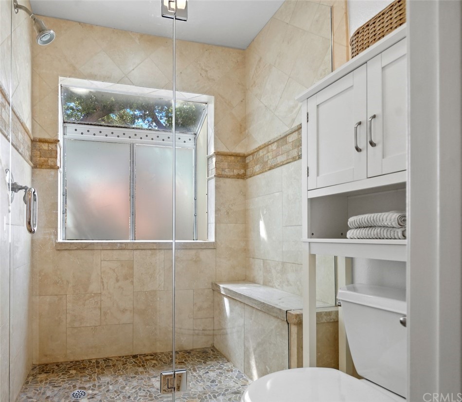 6255 Honolulu Avenue, Unit 23 Tujunga, CA 91042 - Photo 25 of 36 a bathroom with a granite countertop sink and a mirror