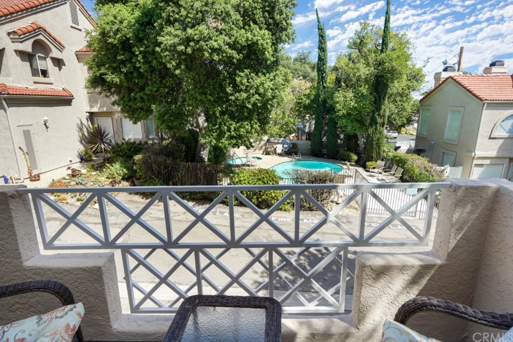 6255 Honolulu Avenue, Unit 23 Tujunga, CA 91042 - Photo 33 of 36 a view of a patio with table and chairs and potted plants
