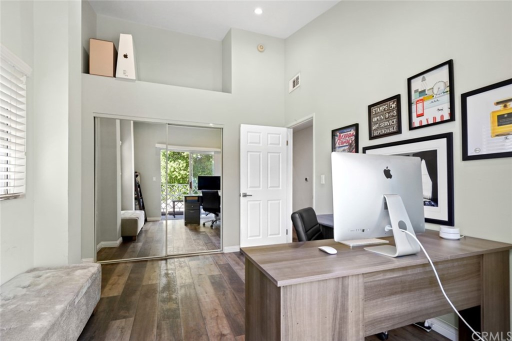 6255 Honolulu Avenue, Unit 23 Tujunga, CA 91042 - Photo 34 of 36 a living room with furniture a wooden floor and a large window