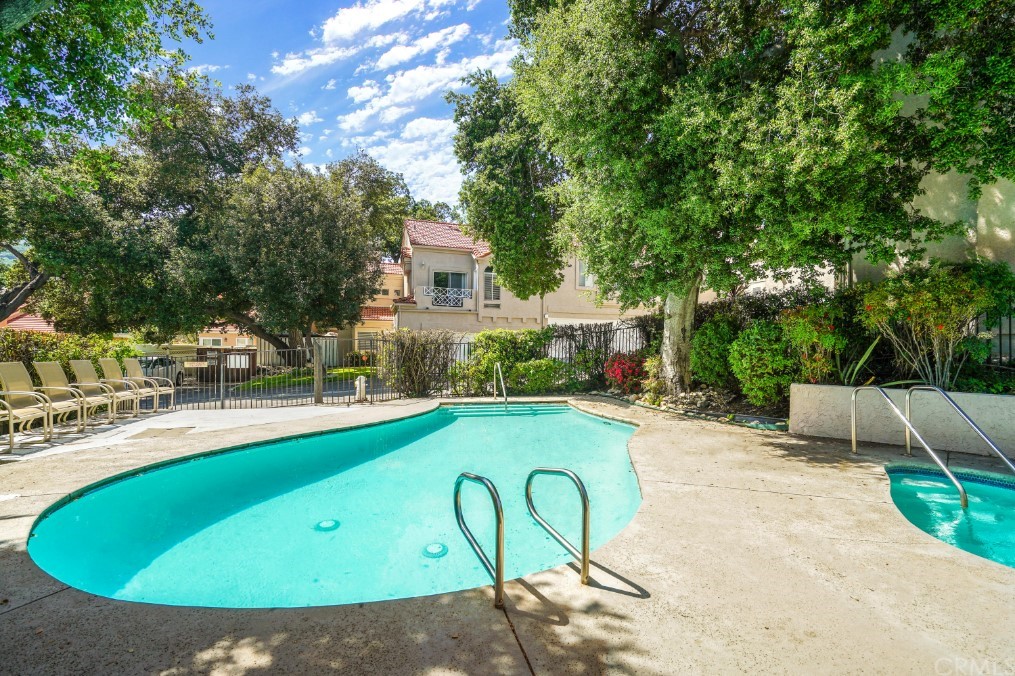 6255 Honolulu Avenue, Unit 23 Tujunga, CA 91042 - Photo 36 of 36 a view of a swimming pool with a patio