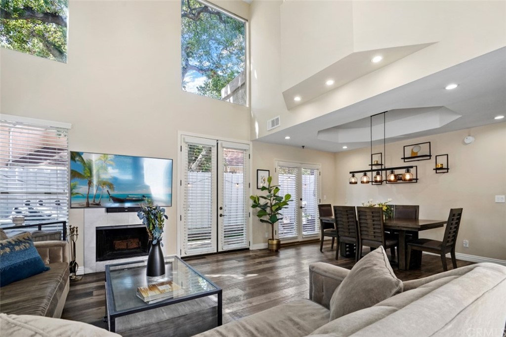 6255 Honolulu Avenue, Unit 23 Tujunga, CA 91042 - Photo 4 of 36 a living room with furniture and a fireplace