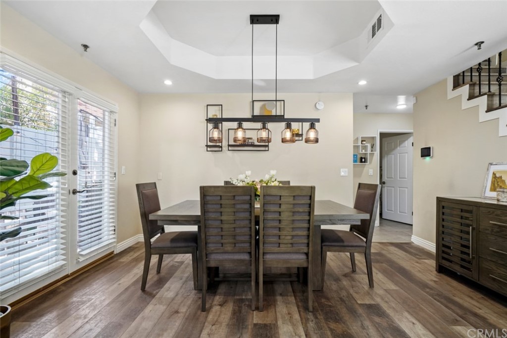 6255 Honolulu Avenue, Unit 23 Tujunga, CA 91042 - Photo 6 of 36 a view of a dining room with furniture window and wooden floor