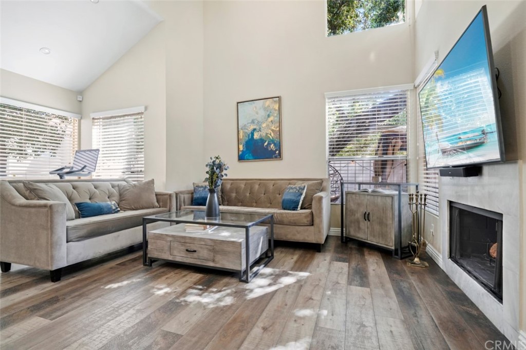 6255 Honolulu Avenue, Unit 23 Tujunga, CA 91042 - Photo 7 of 36 a living room with furniture large window and fireplace