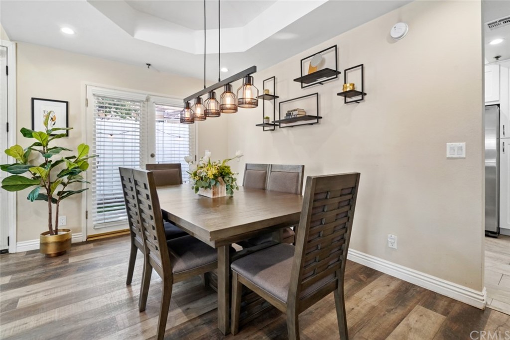 6255 Honolulu Avenue, Unit 23 Tujunga, CA 91042 - Photo 9 of 36 a view of a dining room with furniture and wooden floor