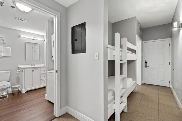 a bathroom with a tub shower and mirror