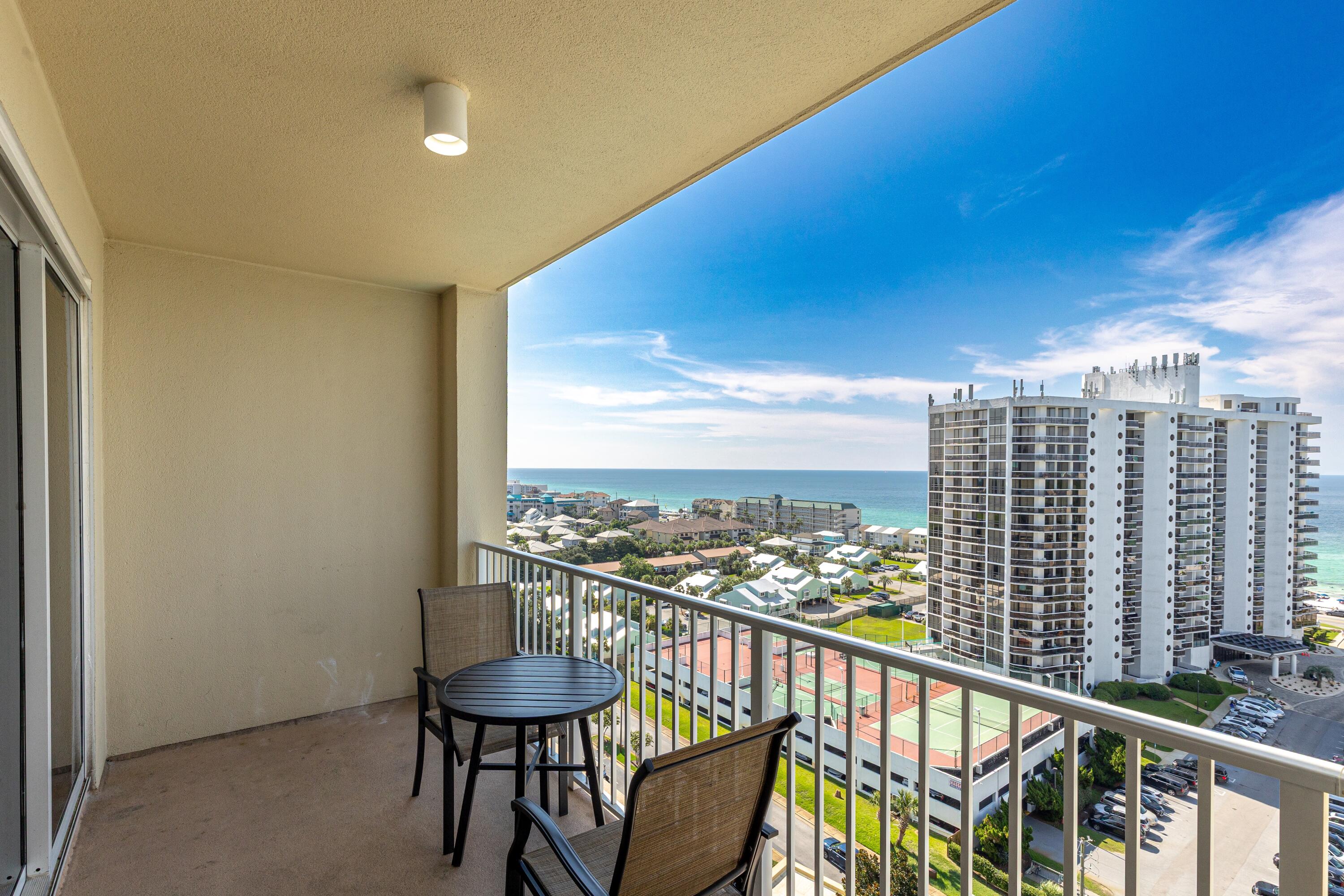 112 Seascape Drive, Unit 1306 Miramar Beach, FL 32550 - Photo 14 of 28 a view of a chairs and table in patio
