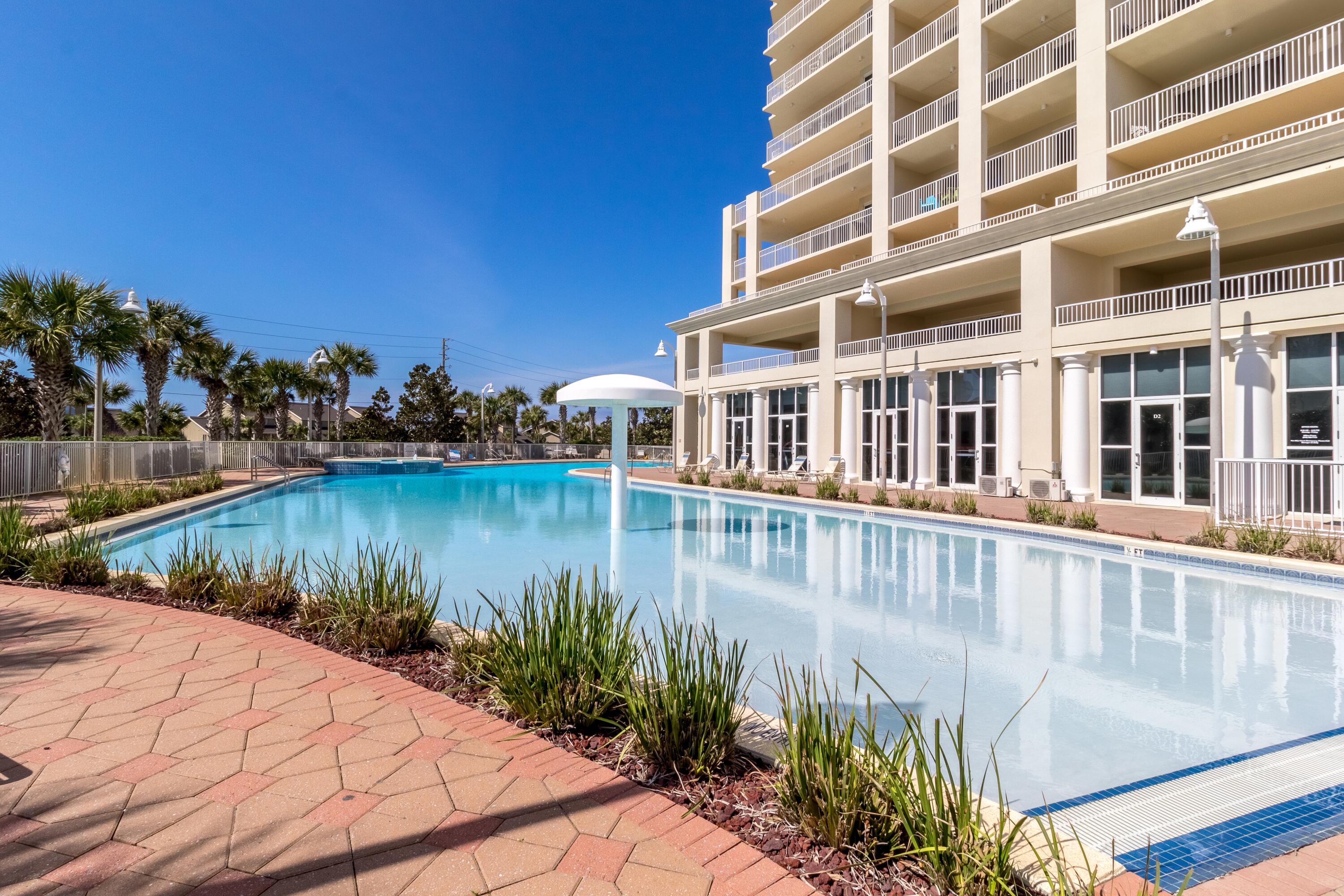 112 Seascape Drive, Unit 1306 Miramar Beach, FL 32550 - Photo 27 of 28 a view of a swimming pool with a lake view