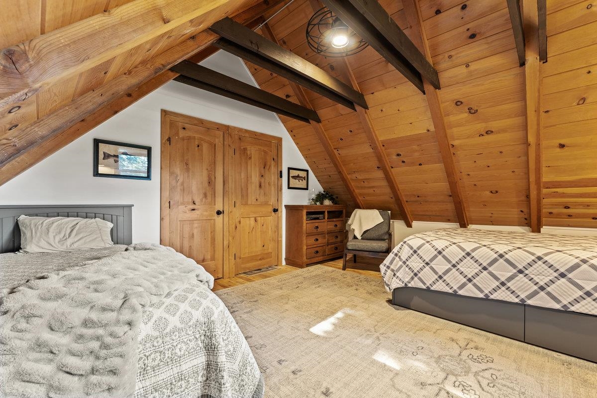 10175 Washoe Road Truckee, CA 96161 - Photo 11 of 20 a bedroom with a bed and wooden floor