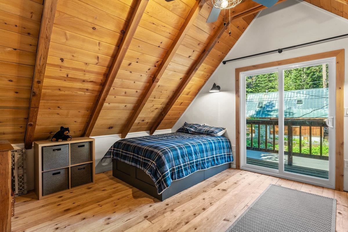 10175 Washoe Road Truckee, CA 96161 - Photo 14 of 20 a room with a bed and wooden floor