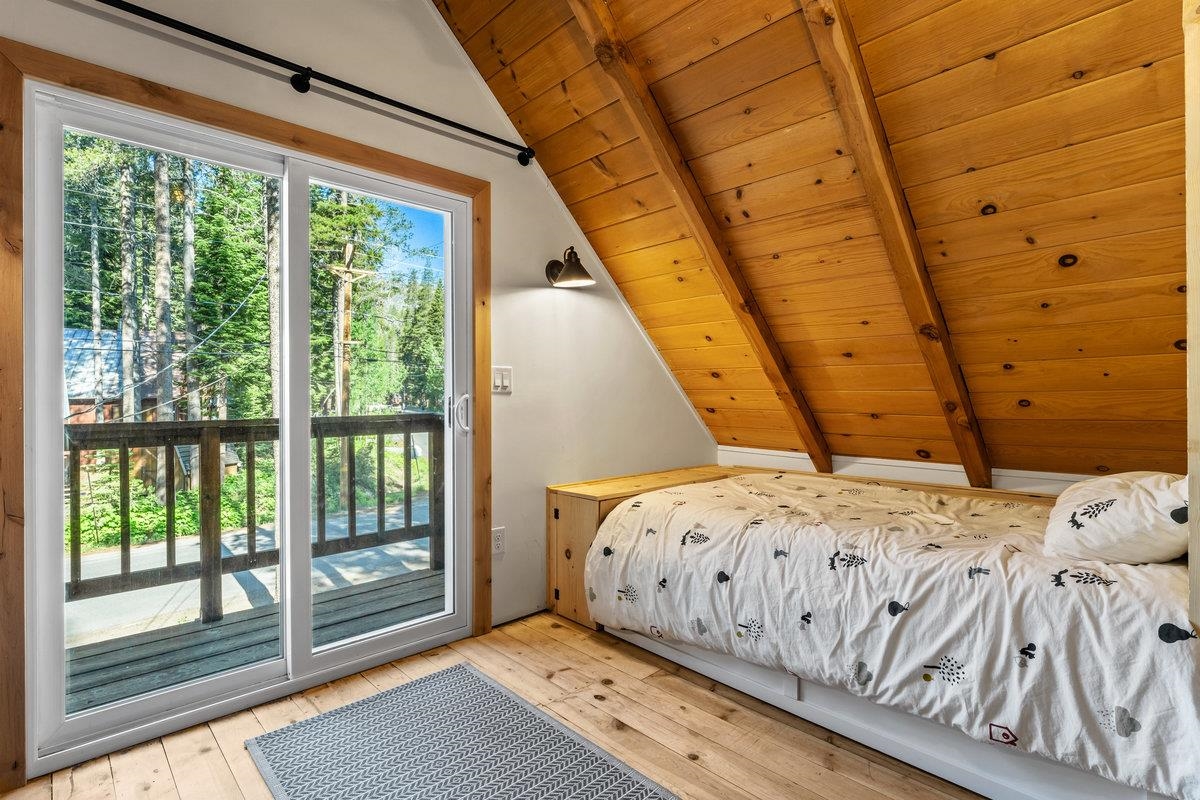 10175 Washoe Road Truckee, CA 96161 - Photo 15 of 20 a bedroom with a bed and wooden floor