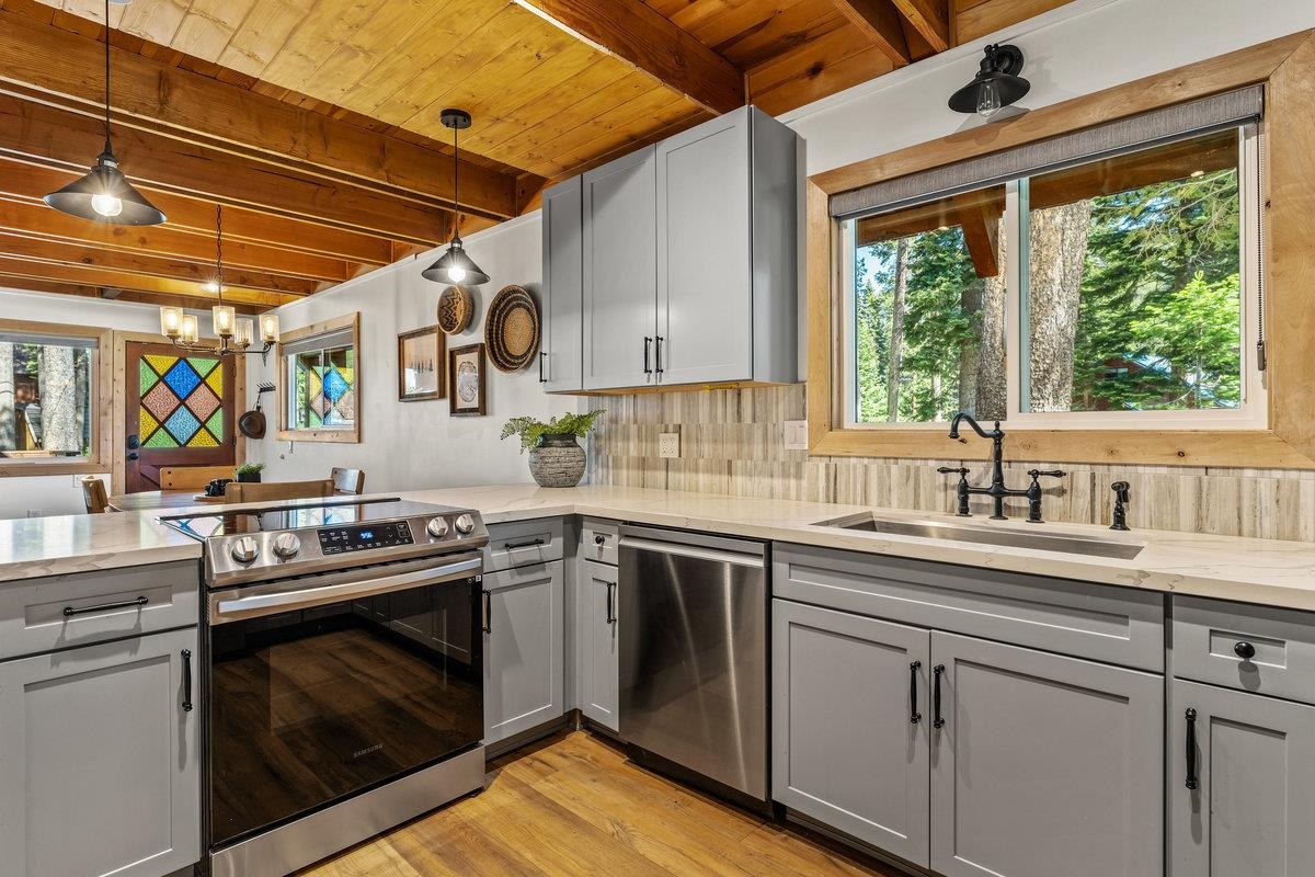 10175 Washoe Road Truckee, CA 96161 - Photo 6 of 20 a kitchen with a stove sink and cabinets