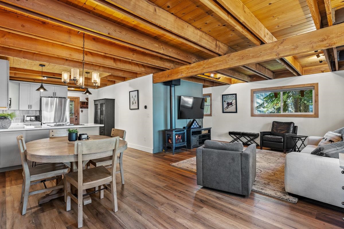 10175 Washoe Road Truckee, CA 96161 - Photo 8 of 20 a dining room with wooden floor and furniture