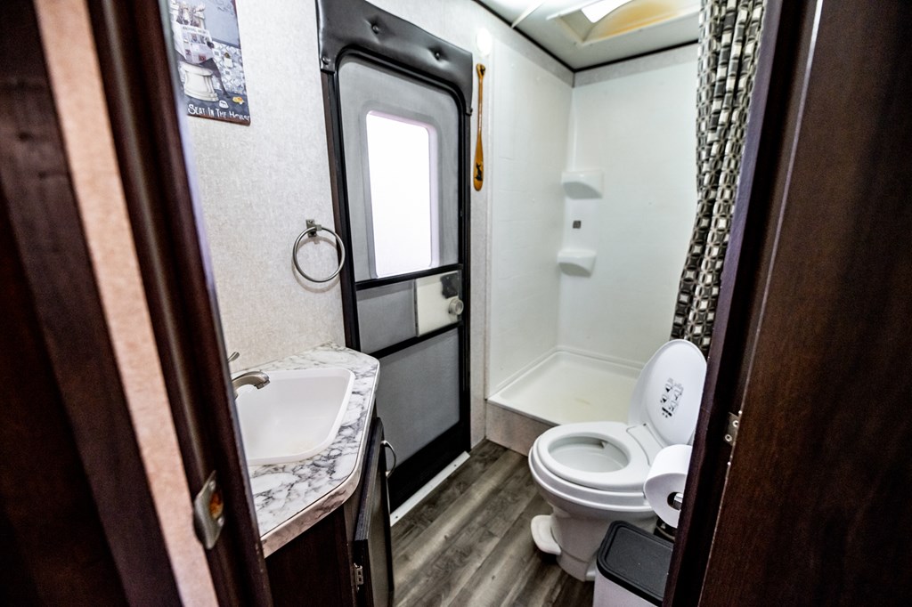 107 23rd Street Ellijay, GA 30540 - Photo 14 of 45 a bathroom with a toilet a sink a bath tub and shower