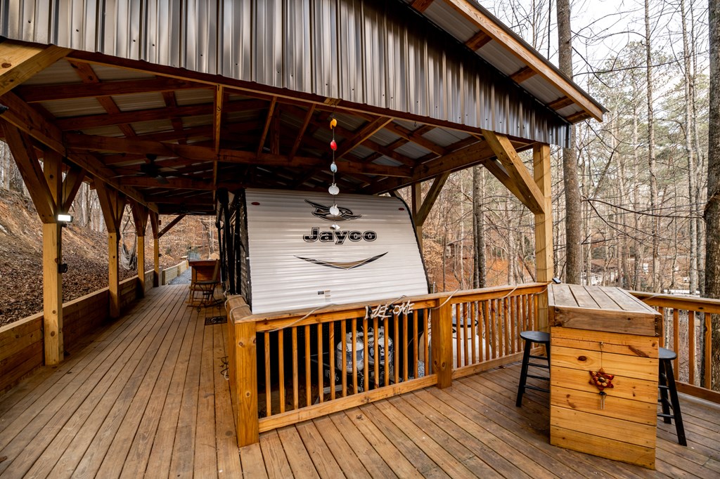 107 23rd Street Ellijay, GA 30540 - Photo 4 of 45 a view of deck with wooden floor and outdoor seating