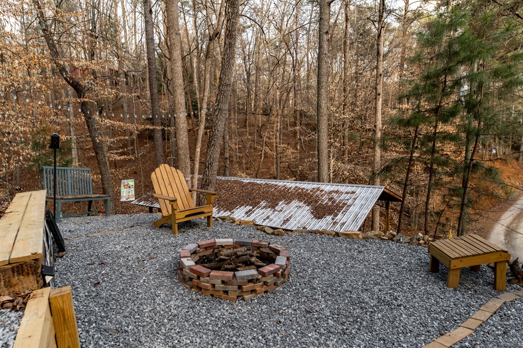 107 23rd Street Ellijay, GA 30540 - Photo 9 of 45 a wooden bench sitting in the middle of a