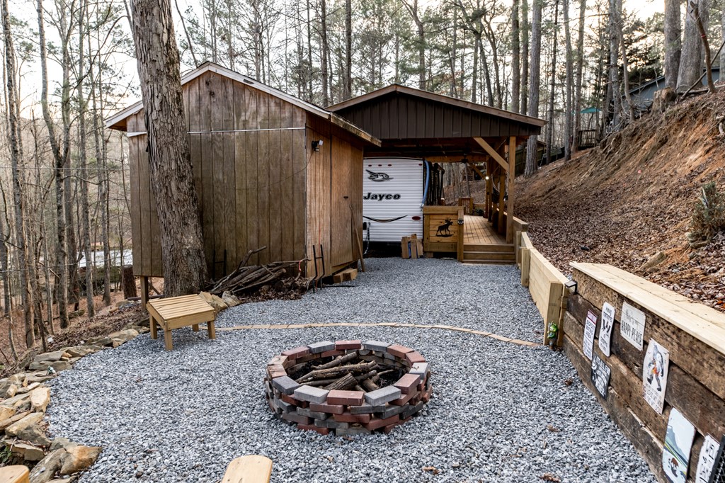 107 23rd Street Ellijay, GA 30540 - Photo 10 of 45 a backyard of a house with barbeque oven table and chairs