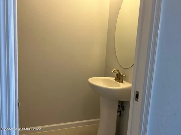 a bathroom with a sink and mirror