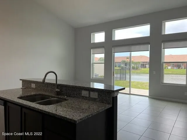 a kitchen with a sink and a window