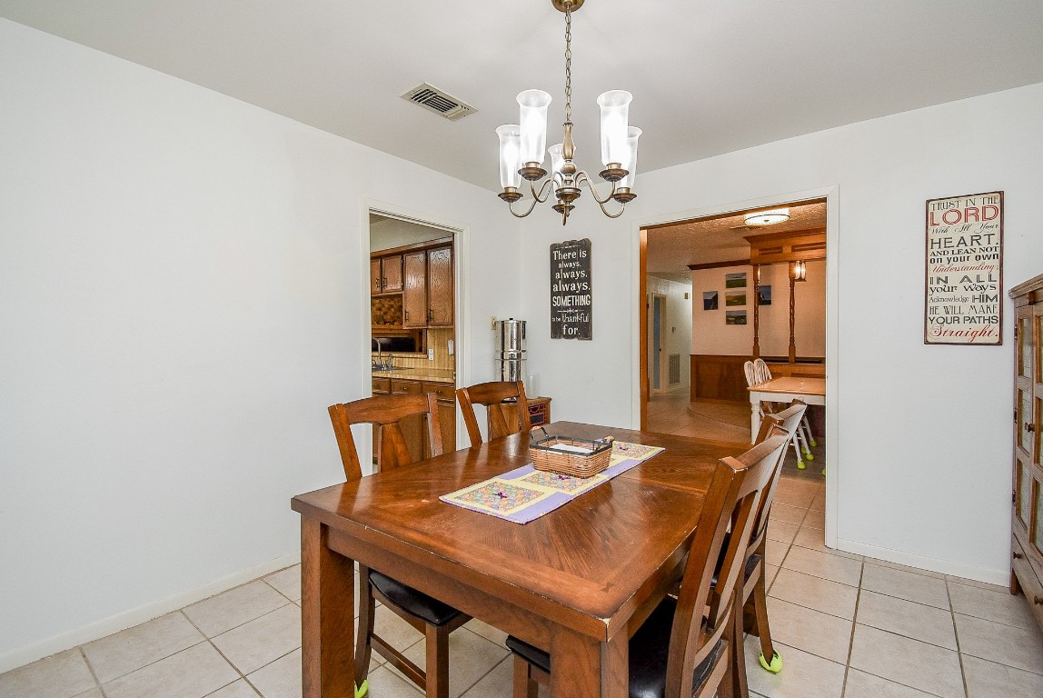 2719 Vail Road Rosenberg, TX 77471 - Photo 24 of 37 a view of a dining room with furniture and a chandelier