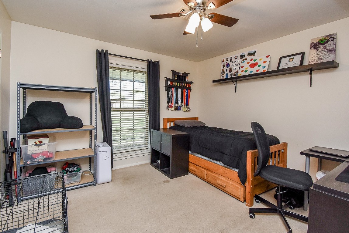 2719 Vail Road Rosenberg, TX 77471 - Photo 35 of 37 a bedroom with furniture and a window