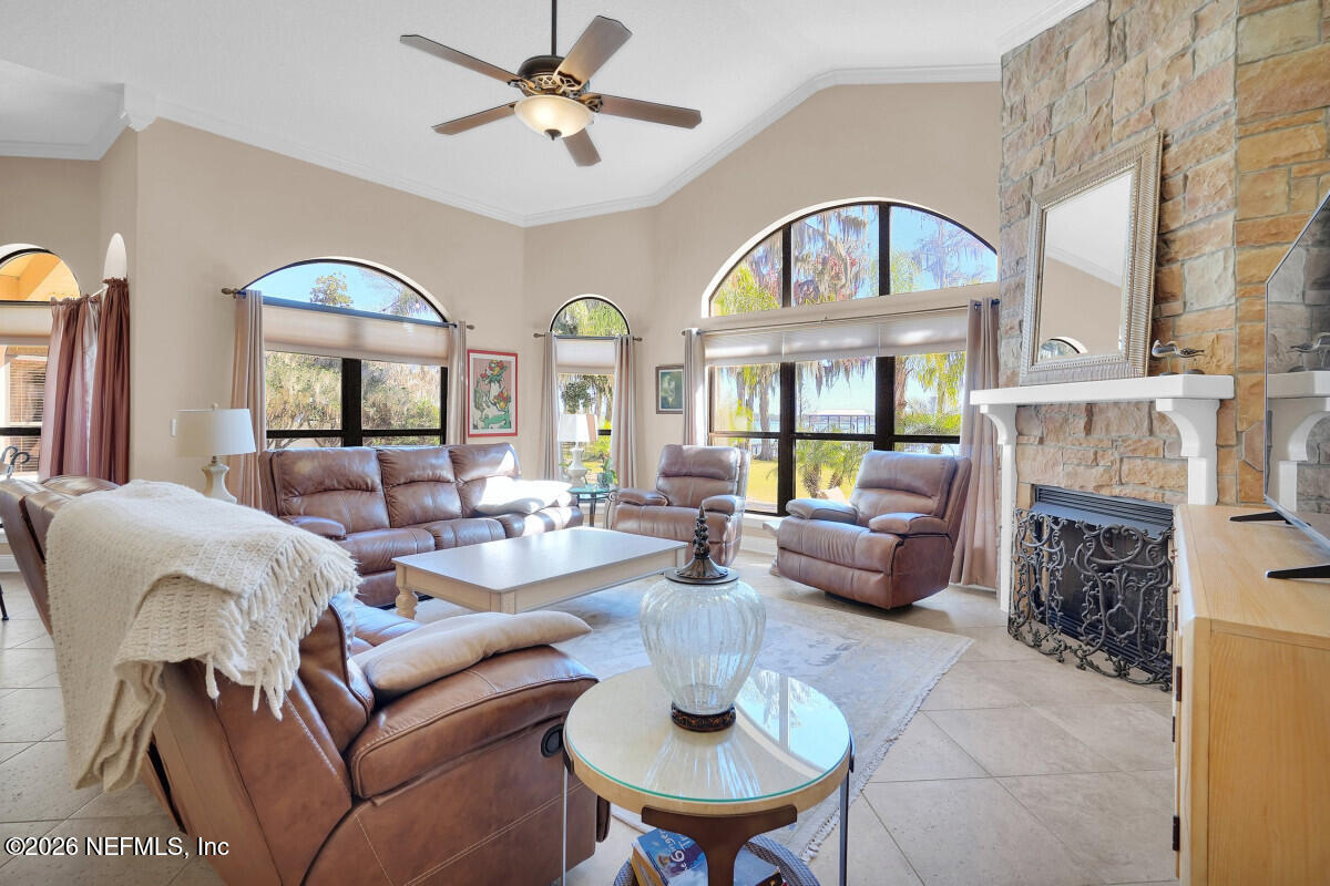 2942 Magnolia Road Orange Park, FL 32065 - Photo 14 of 50 a living room with fireplace furniture and a large window