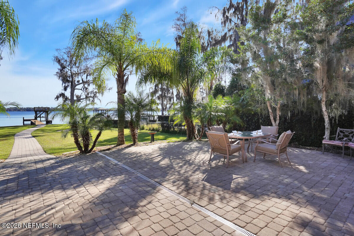 2942 Magnolia Road Orange Park, FL 32065 - Photo 19 of 50 a view of a backyard with swimming pool and sitting area