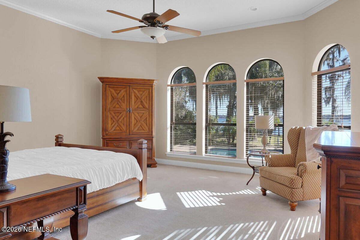 2942 Magnolia Road Orange Park, FL 32065 - Photo 20 of 50 a bedroom with a bed couch and window