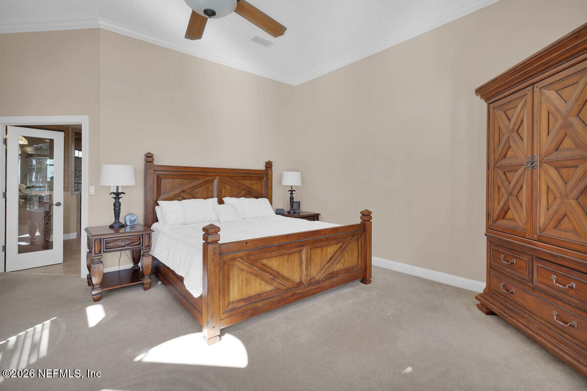 2942 Magnolia Road Orange Park, FL 32065 - Photo 22 of 50 a bed room with a bed and a couch