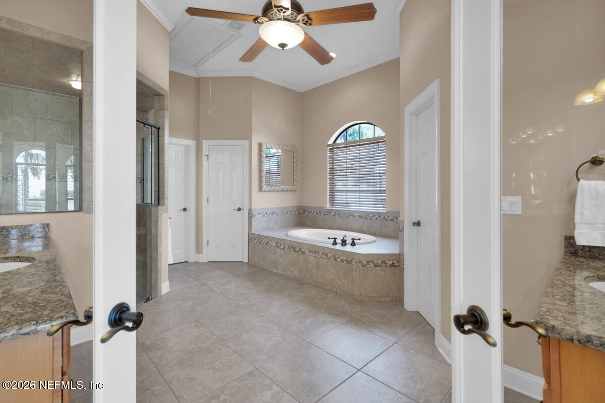 2942 Magnolia Road Orange Park, FL 32065 - Photo 23 of 50 a large bathroom with a tub shower and sink