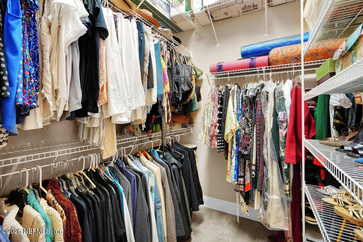 2942 Magnolia Road Orange Park, FL 32065 - Photo 26 of 50 a view of walk in closet with clothes and shoes
