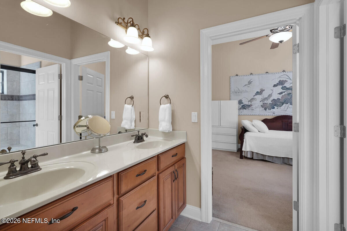 2942 Magnolia Road Orange Park, FL 32065 - Photo 34 of 50 a en suite bathroom with double sink and a mirror