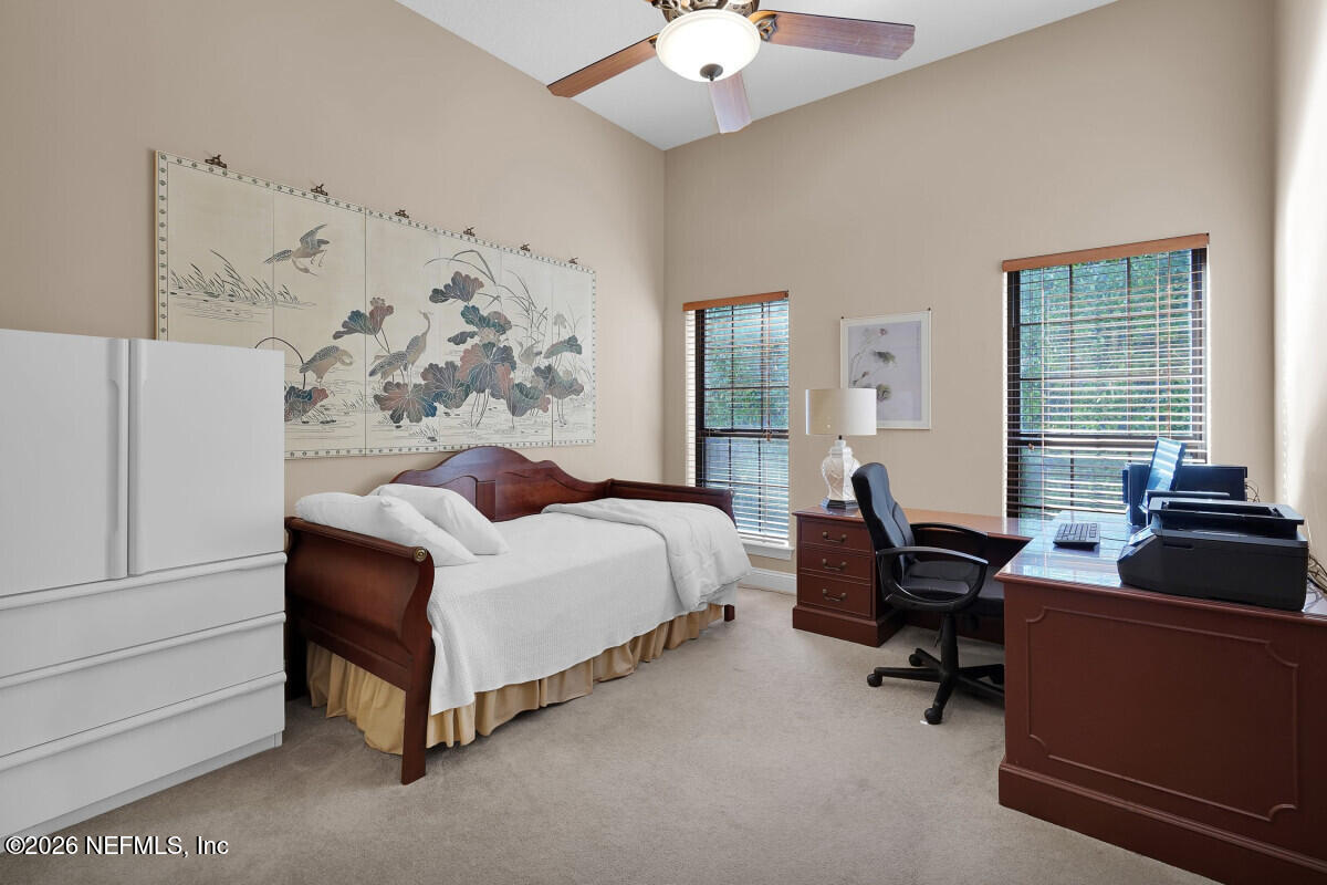 2942 Magnolia Road Orange Park, FL 32065 - Photo 36 of 50 a bedroom with a bed couch and window