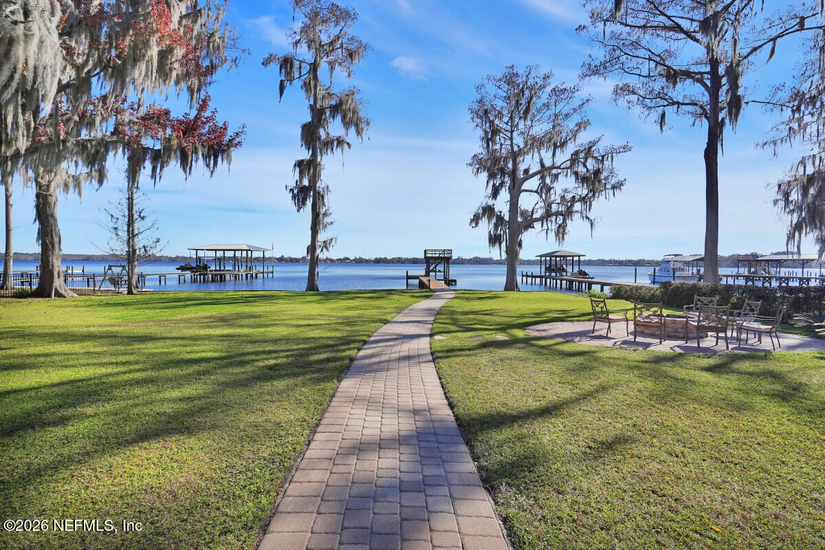 2942 Magnolia Road Orange Park, FL 32065 - Photo 41 of 50 a view of a swimming pool with a garden